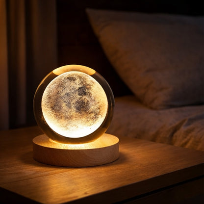 Moon lamp on a wooden base in a cozy bedroom setting