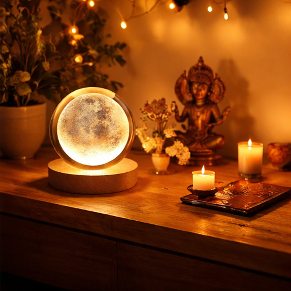 Moon lamp on a wooden surface with candles and decorative items in the background