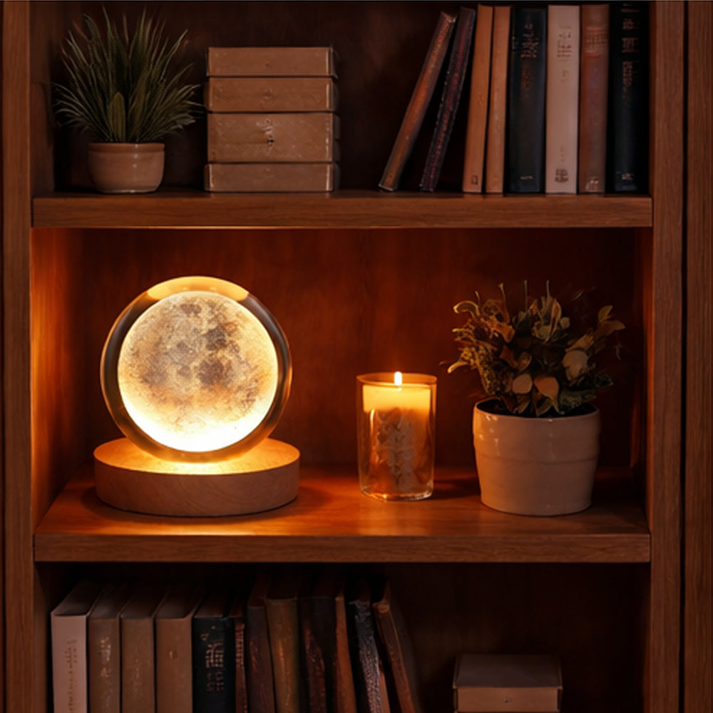 Moon lamp on a wooden shelf with books and plants
