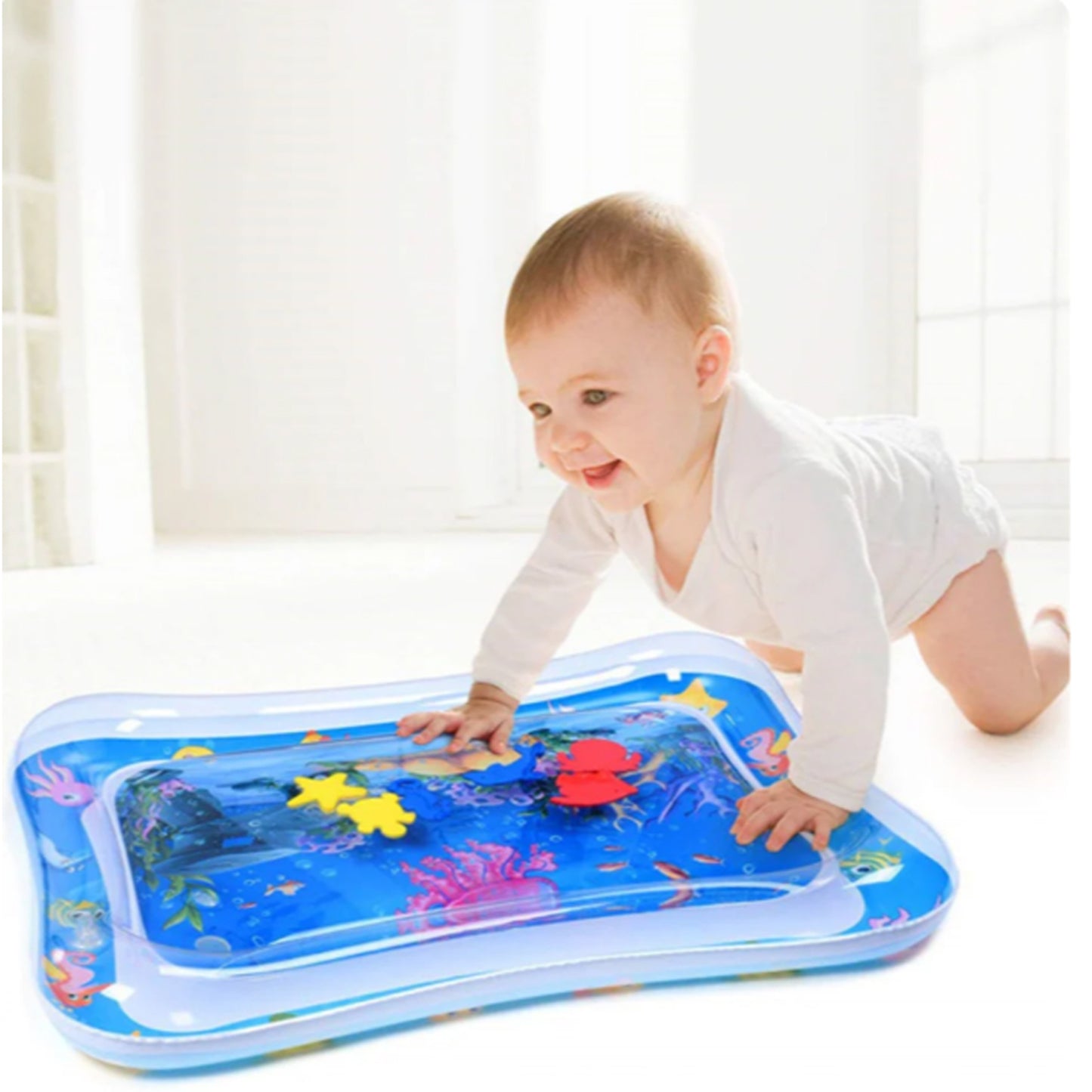 Baby playing on inflatable tummy time activity water mat