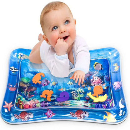 Baby enjoying tummy time on inflatable baby water play mat with ocean theme