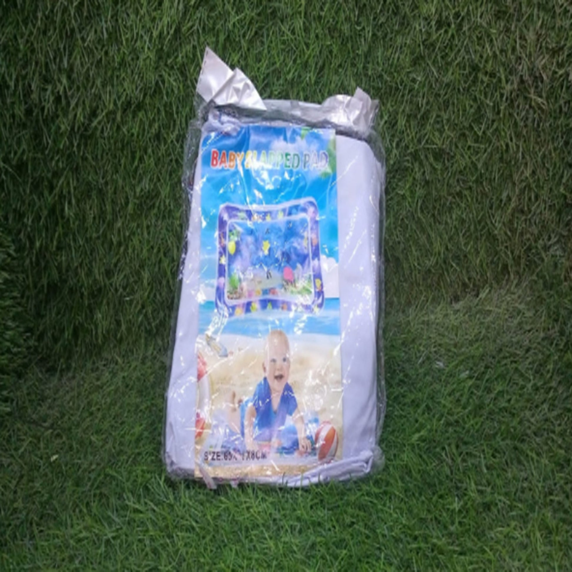 Baby playing on inflatable tummy time activity water mat