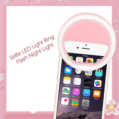 Pink clip-on selfie ring light attached to smartphone for enhanced front camera lighting
